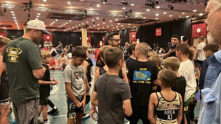 Coach talking to the BC Iron team at Brawl at the Beach