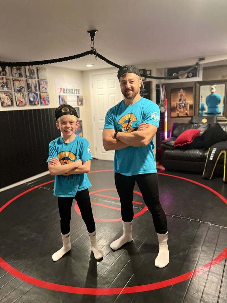 Jordan and his dad on the home mat