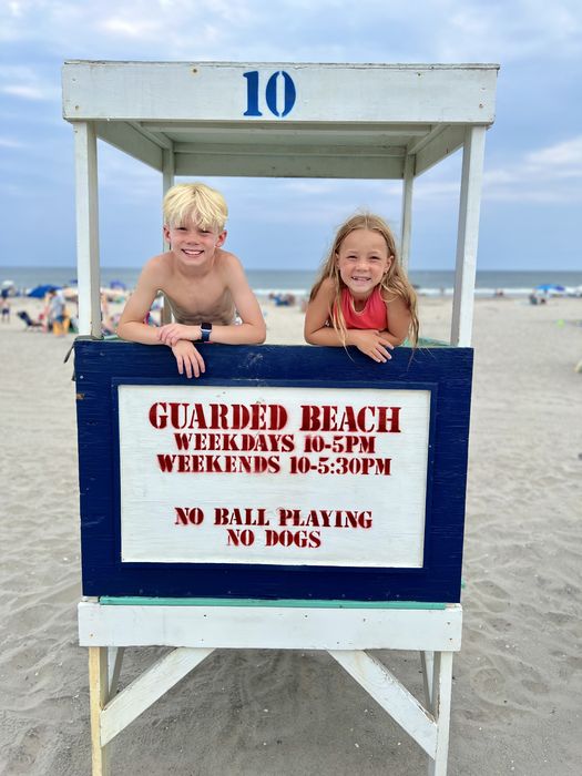 Jordan on a lifeguard stand at the beach
