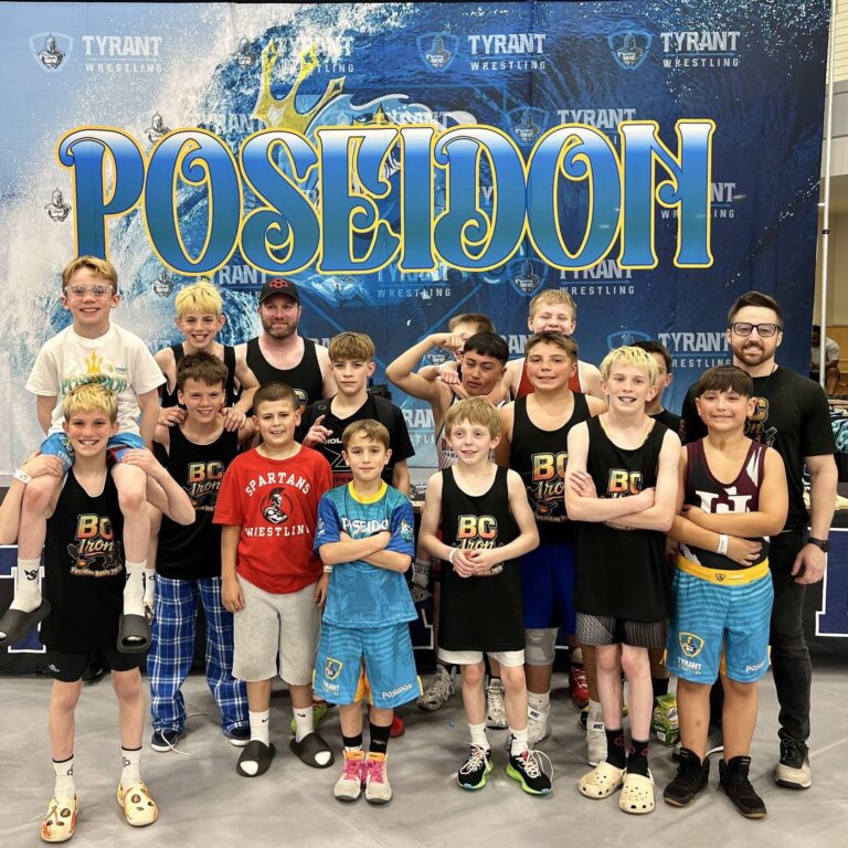 BC Iron in front of the Poseidon banner
