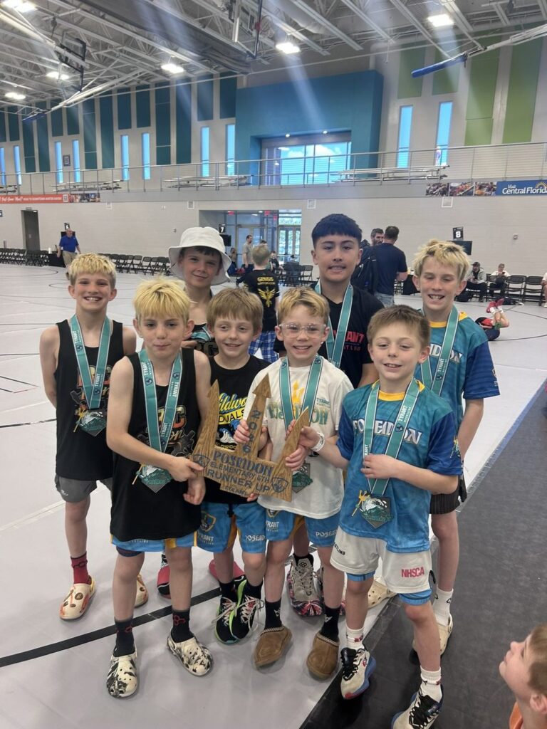 BC Iron wrestlers with their medals and trophy at the Poseidon Duals